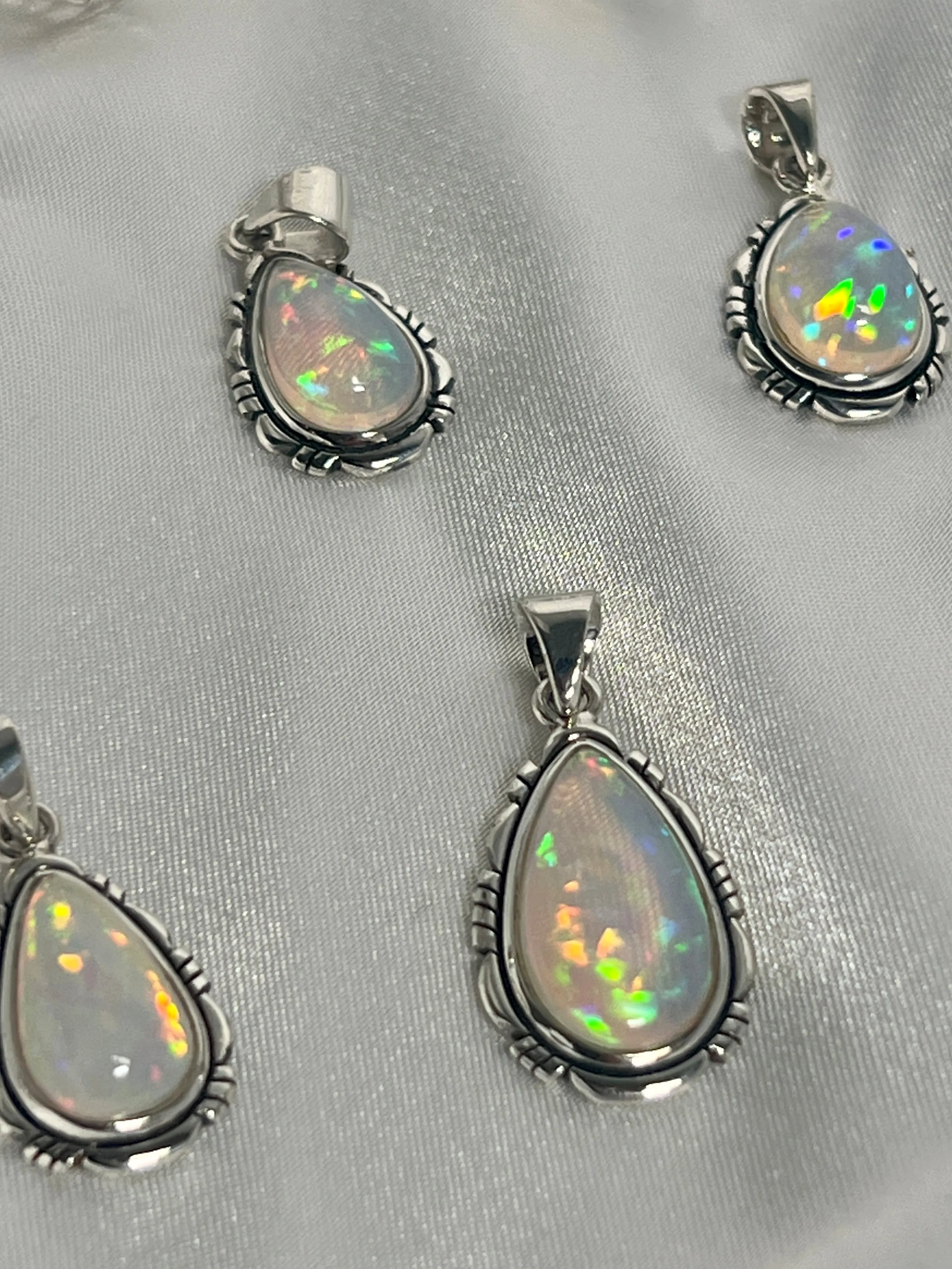 Ethiopian Opal Teardrop Shaped Pendant with Detailed Setting
