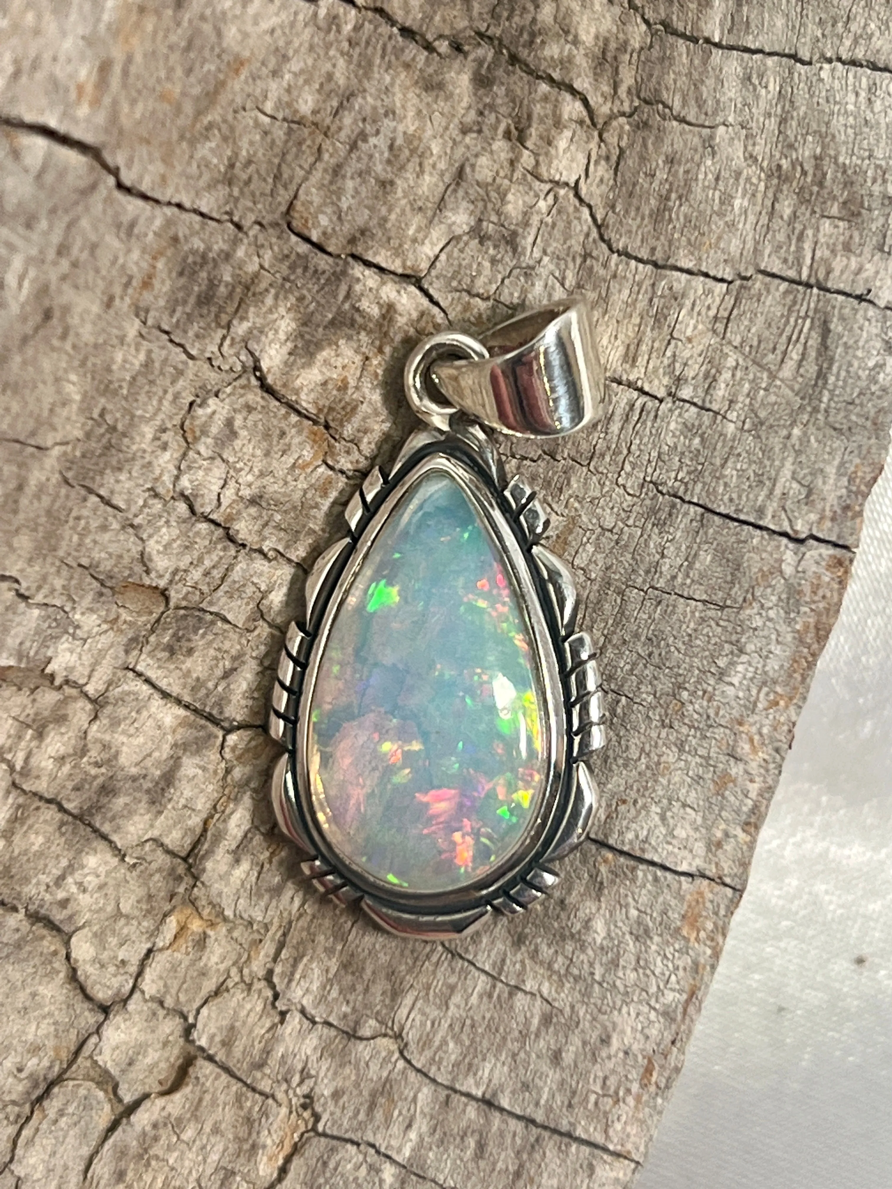 Ethiopian Opal Teardrop Shaped Pendant with Detailed Setting