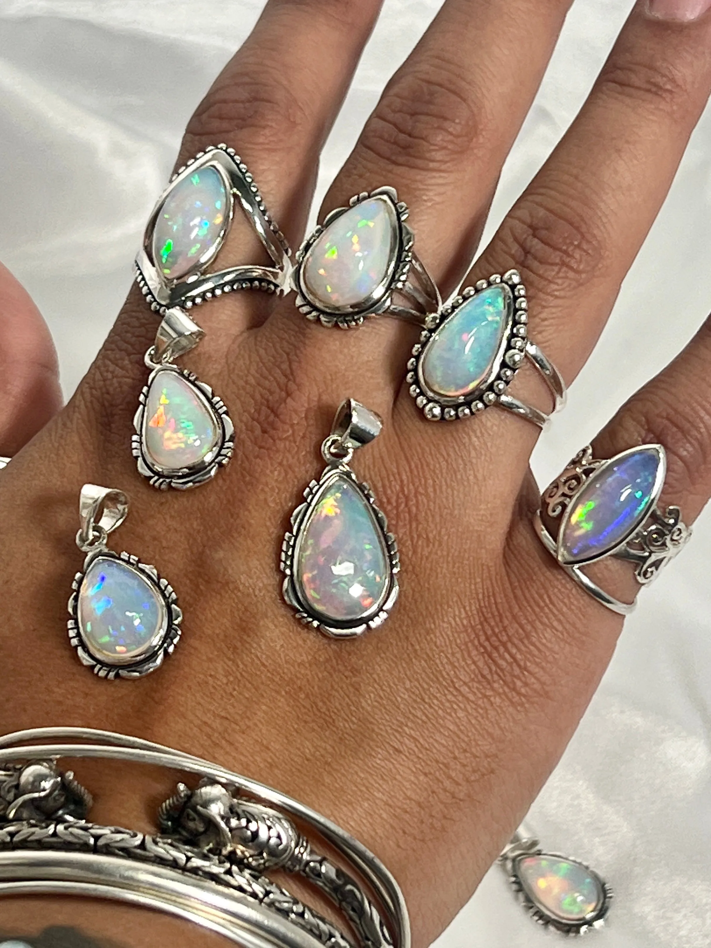 Ethiopian Opal Teardrop Shaped Pendant with Detailed Setting