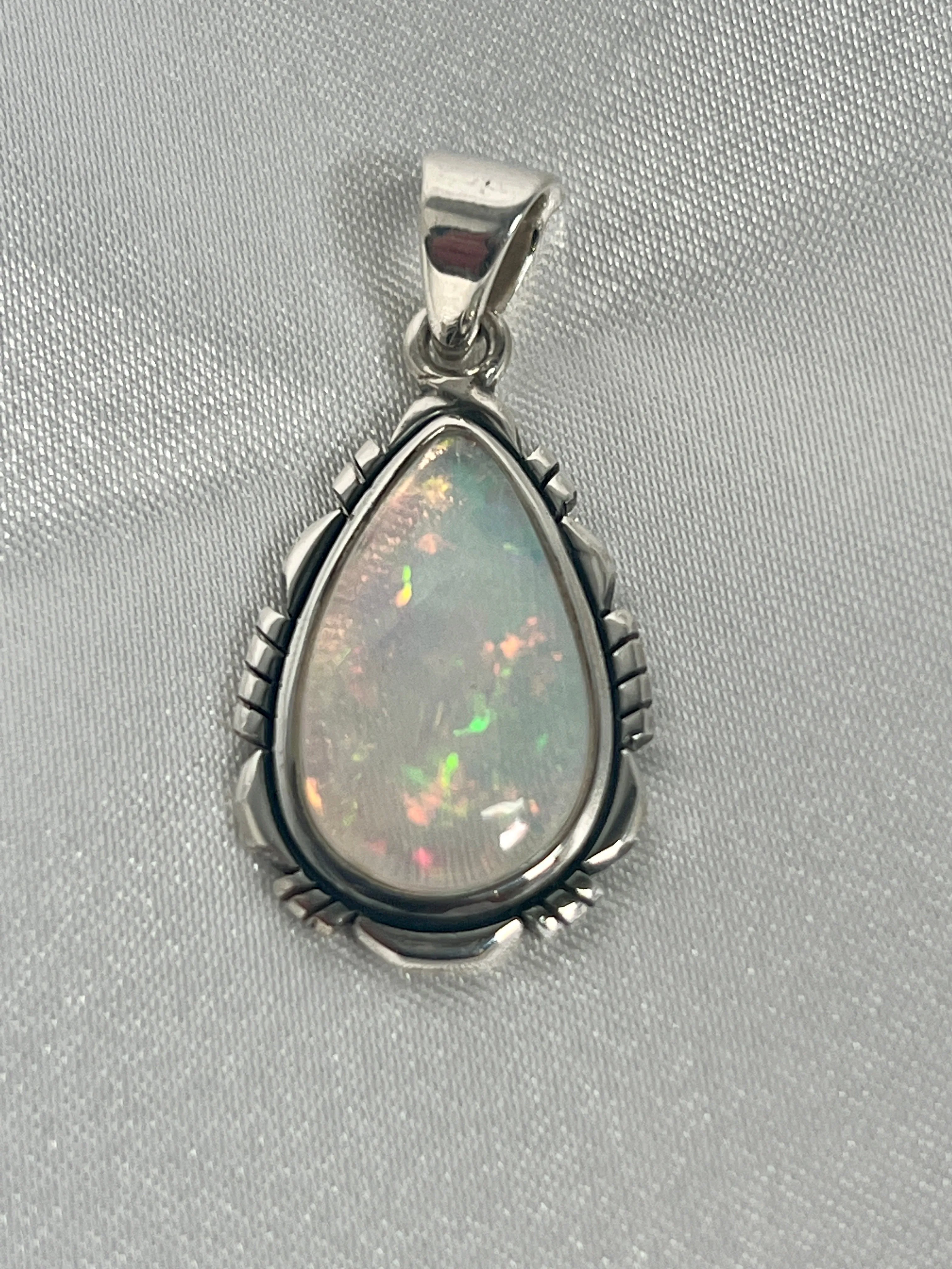 Ethiopian Opal Teardrop Shaped Pendant with Detailed Setting