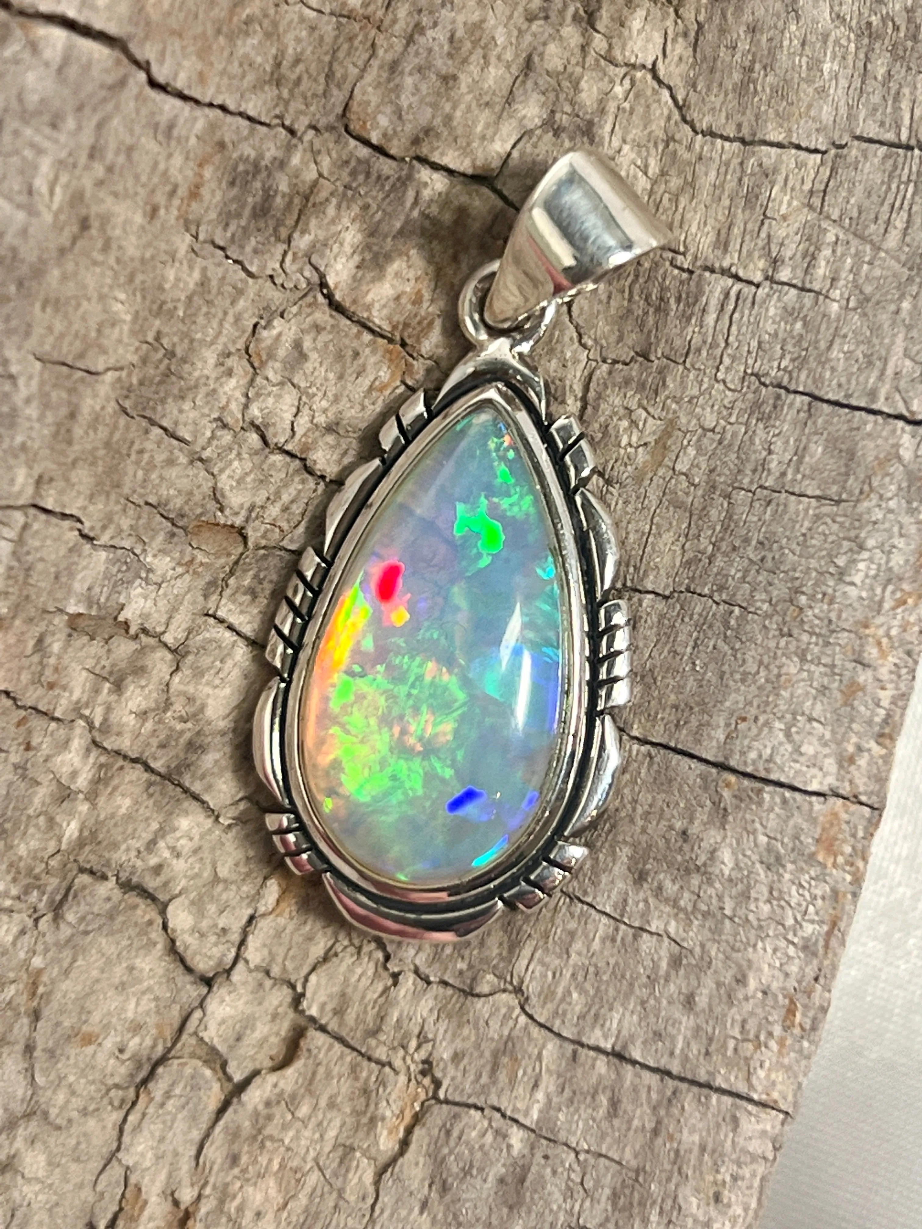 Ethiopian Opal Teardrop Shaped Pendant with Detailed Setting