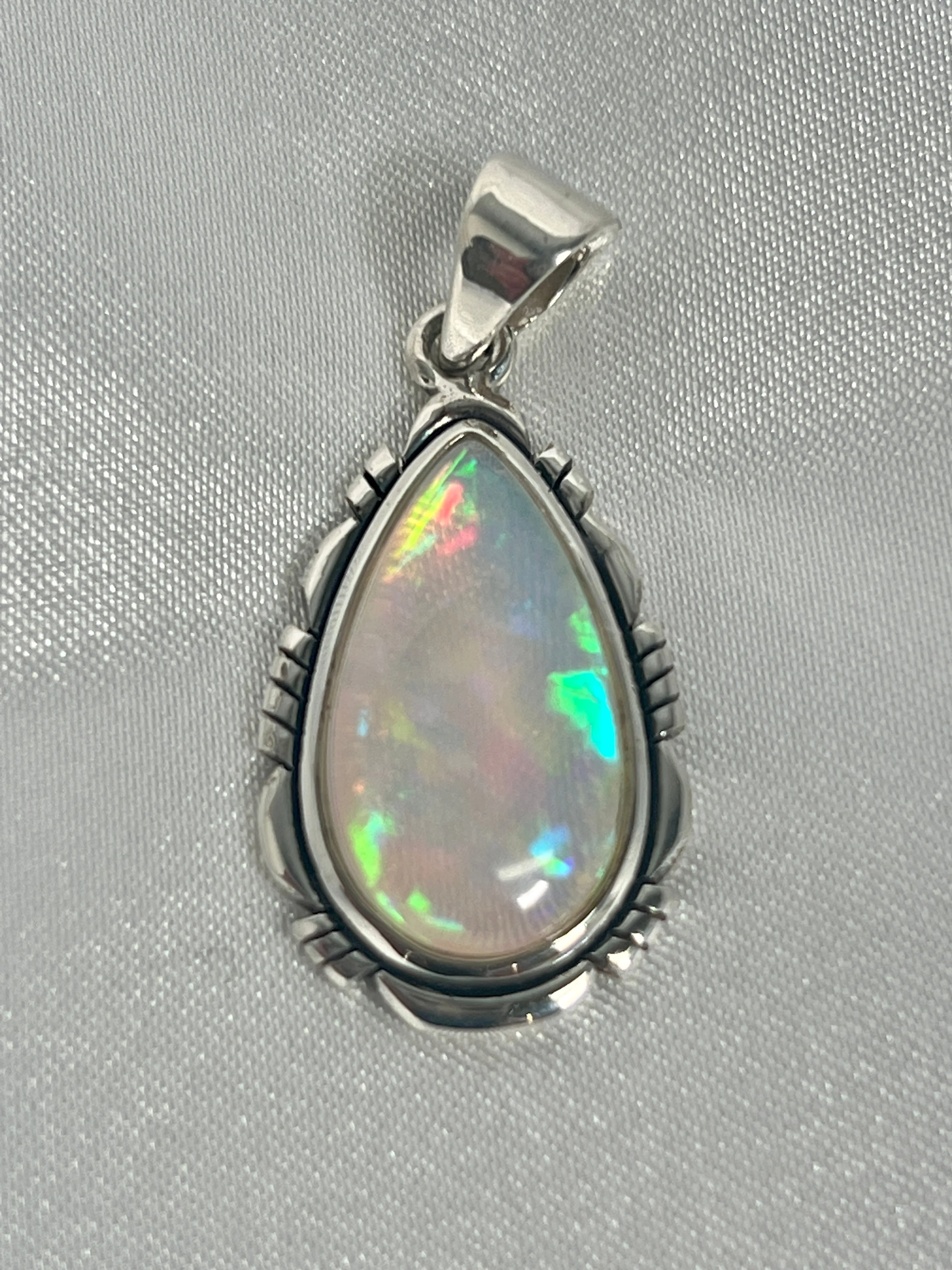 Ethiopian Opal Teardrop Shaped Pendant with Detailed Setting